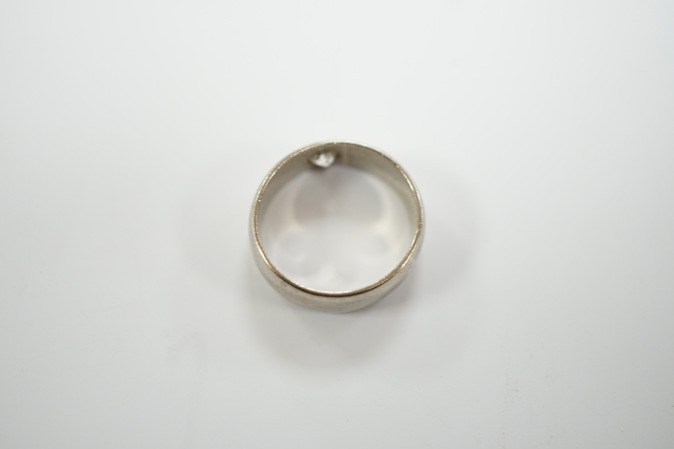 An 18ct white gold and gypsy set solitaire diamond ring, size G, gross weight 5.4 grams.